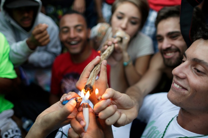 Demonstrators smoke a giant joint of cannabis during a pro-marijuana legalization march in Brasilia